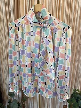 vintage 1980s pastel colored abstract button-up secretary blouse tie neck.